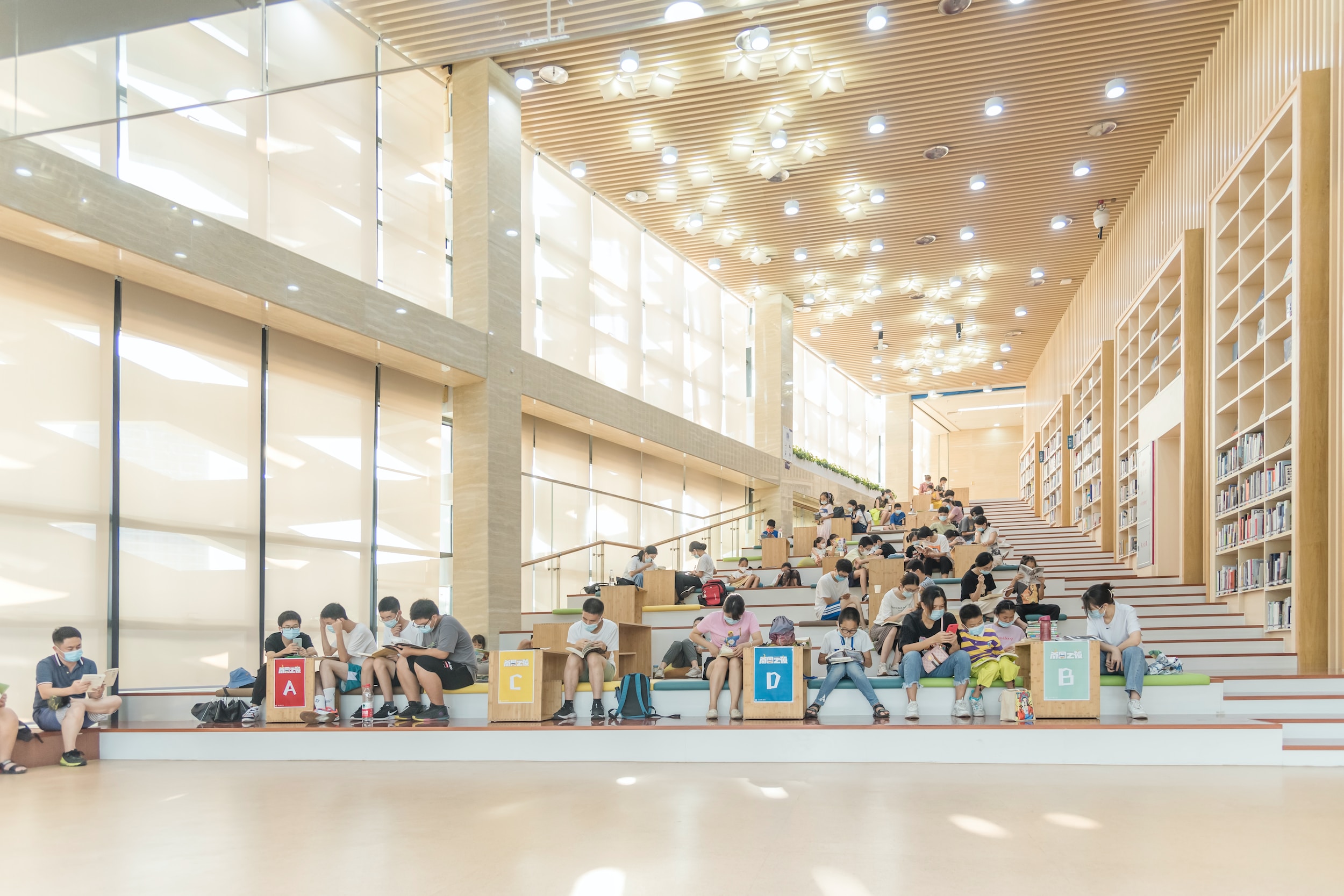 young people reading in a theatre